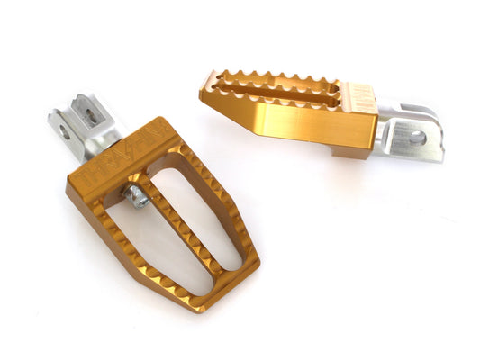 Militant Footpegs – Gold. Fits Softail 2018up Front.